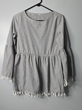 Printed Black & White Tassel-Hem Peplum Top